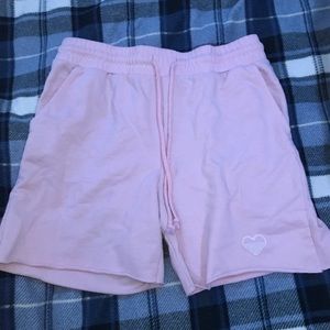 Pink shorts with a heart at the bottom